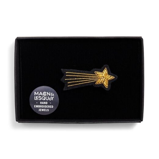 Shooting star shaped embroidered brooch in black velvet lined box